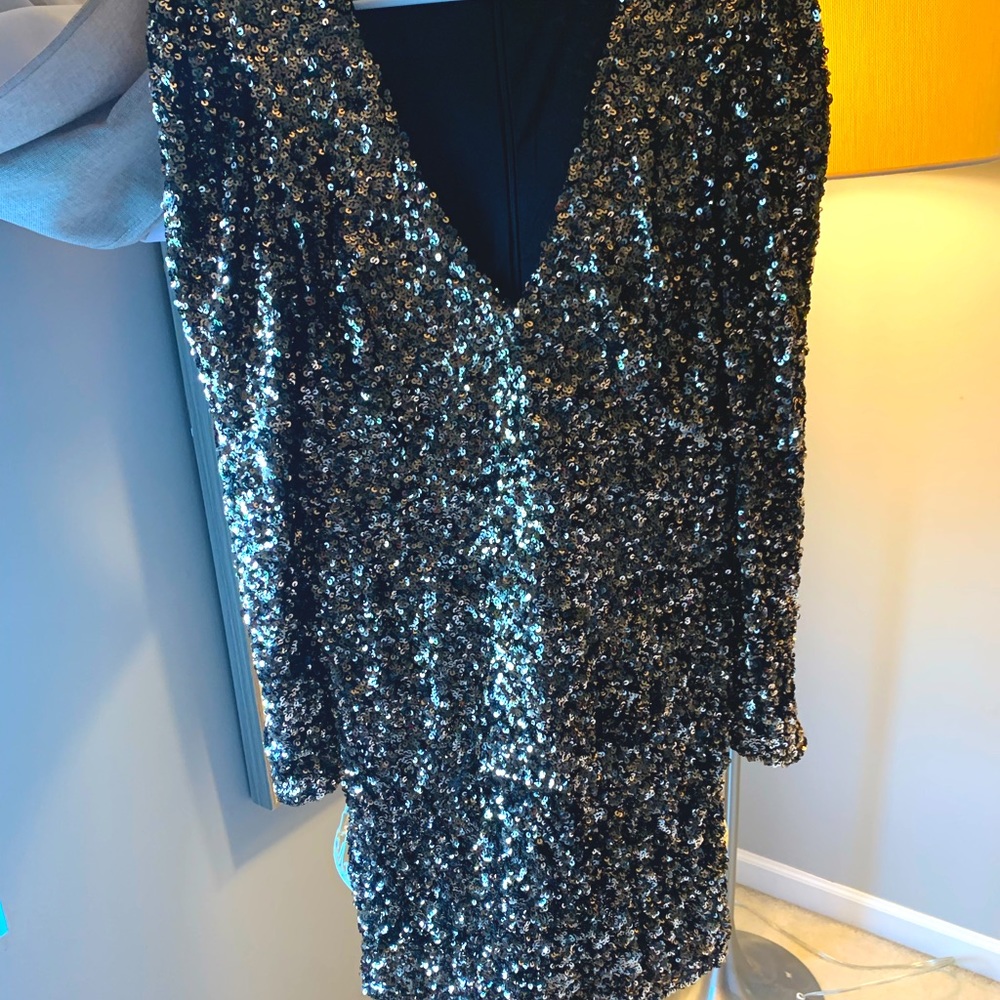 Lulus gorgeous sparkly dress with long sleeves and a little above knee length!